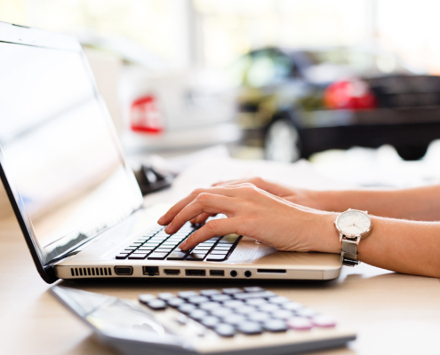 Car shop dealer working on financial documents