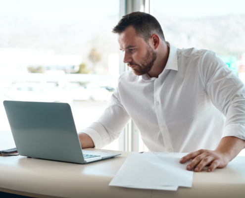 Laptop, documents and car sales man with invoice